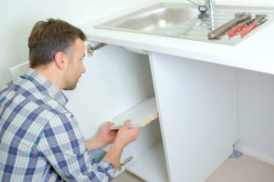 man remodeling a kitchen